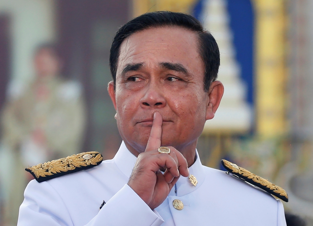 Thailand's Prime Minister Prayuth Chan-ocha reacts while taking questions from journalists after the group photo session with new government Cabinet in Bangkok, Thailand, on Tuesday. — Reuters