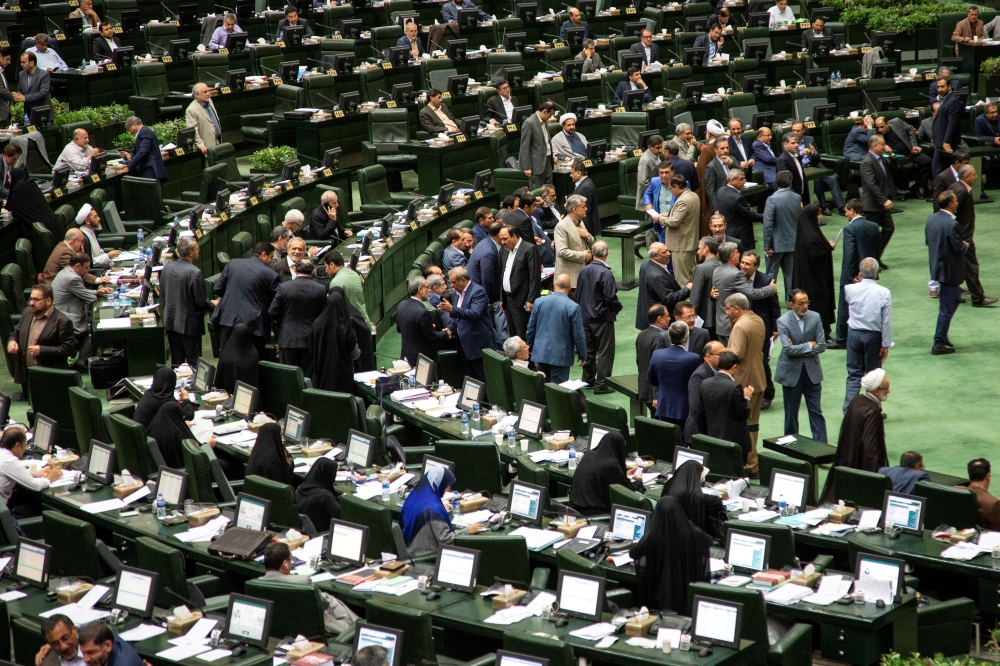 Iranian lawmakers attend a session of parliament in Tehran on Tuesday. — Reuters