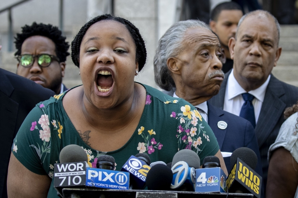 Emerald Garner, daughter of the late Eric Garner, speaks during a press conference outside the US Attorney's office following a meeting with federal prosecutors on Tuesday in the Brooklyn borough of New York City. -AFP