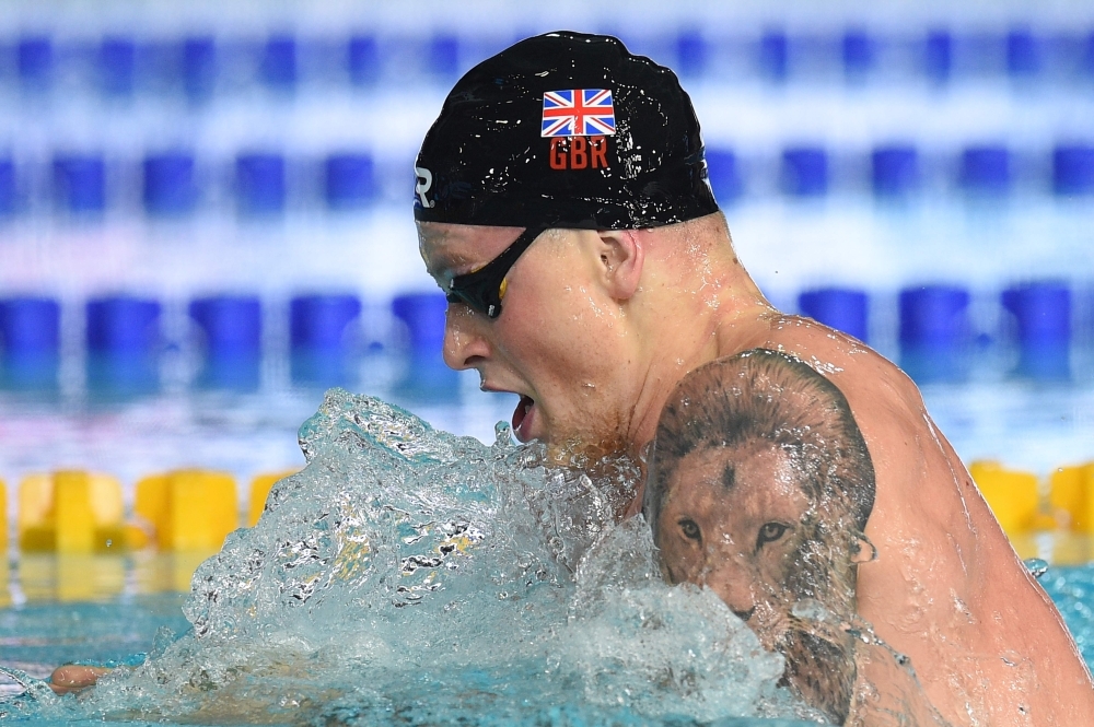 In this file photo taken on Aug. 4, 2018 Britain's Adam Peaty competes in the men's 100m breaststroke swimming final at the Tollcross swimming center during the 2018 European Championships in Glasgow. Virtually untouchable when on song, breaststroke king Adam Peaty spearheads a potent British team at next week's world swimming championships in Gwangju, South Korea. — AFP