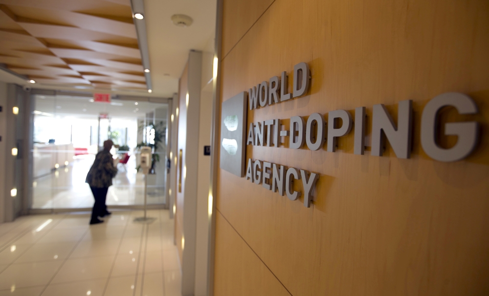 A woman walks into the head office of the World Anti-Doping Agency (WADA) in Montreal, Quebec, Canada in this Nov. 9, 2015 file photo. — Reuters