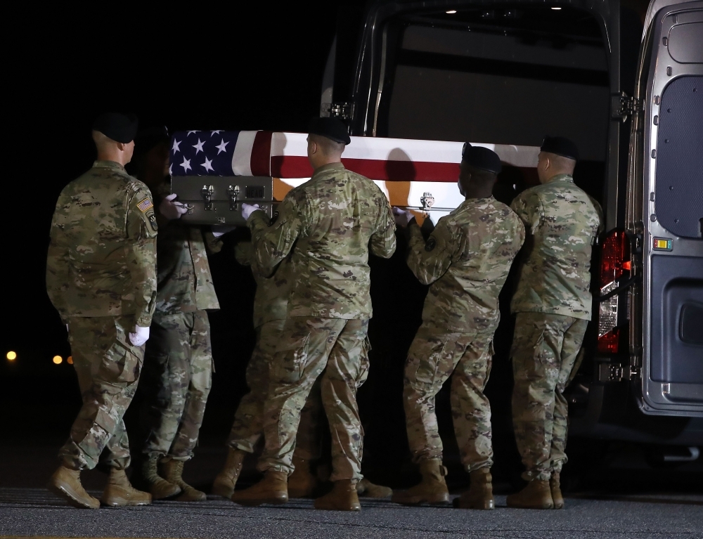 A US Army carry team loads the remains of US Army Sgt. Maj. James G. Sartor into a mortuary van during a dignified transfer at Dover Air Force Base, in Dover, Delaware, in this July 15, 2019 file photo. Sgt. Maj. Sartor, 40, from Teague, Texas was a Special Forces company sergeant major, died July 13th during combat operations in Faryab province, Afghanistan. — AFP