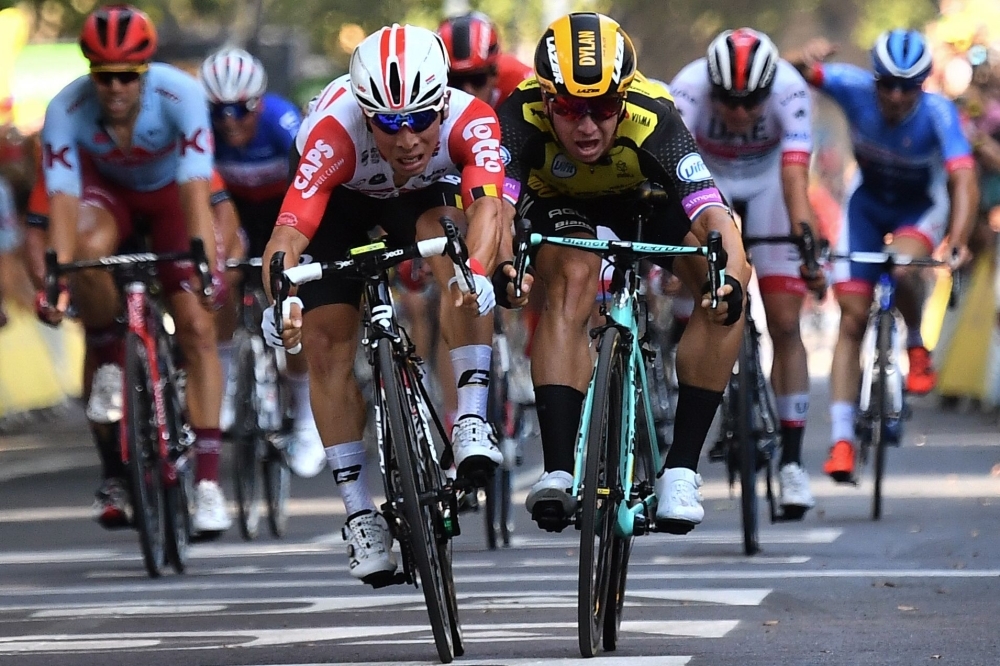 Australia's Caleb Ewan (front L), moves past Netherlands' Dylan Groenewegen to win on the finish line of the eleventh stage of the 106th edition of the Tour de France cycling race between Albi and Toulouse, in Toulouse on Wednesday. — AFP
