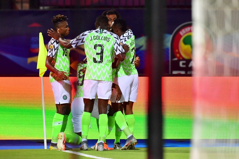 Nigeria's forward Odion Ighalo (2nd-L) celebrates with his team after scoring a goal during the 2019 Africa Cup of Nations (CAN) third place playoff football match between Tunisia and Nigeria at the Al Salam stadium in Cairo on Wednesday. — AFP