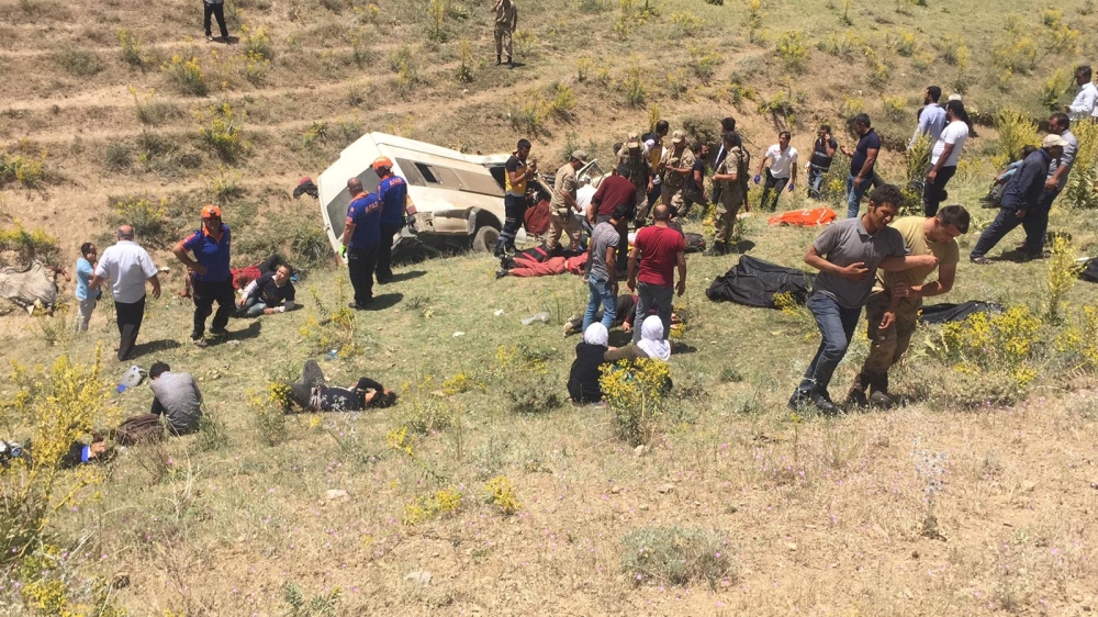 Turkish soldiers and medics carry wounded illegal migrants after a minibus crash in Van, Turkey, on Thursday. — Reuters