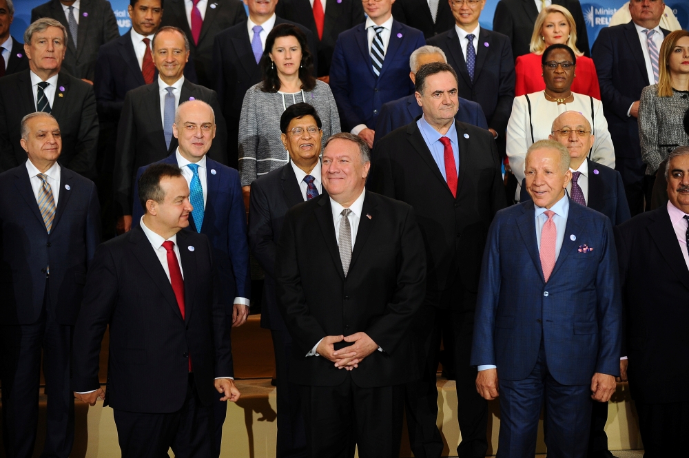 US Secretary of State Mike Pompeo poses in a family photo with participants of the Ministerial to Advance Religious Freedom in Dean Acheson Auditorium at the State Department in Washington, on Thursday. — Reuters