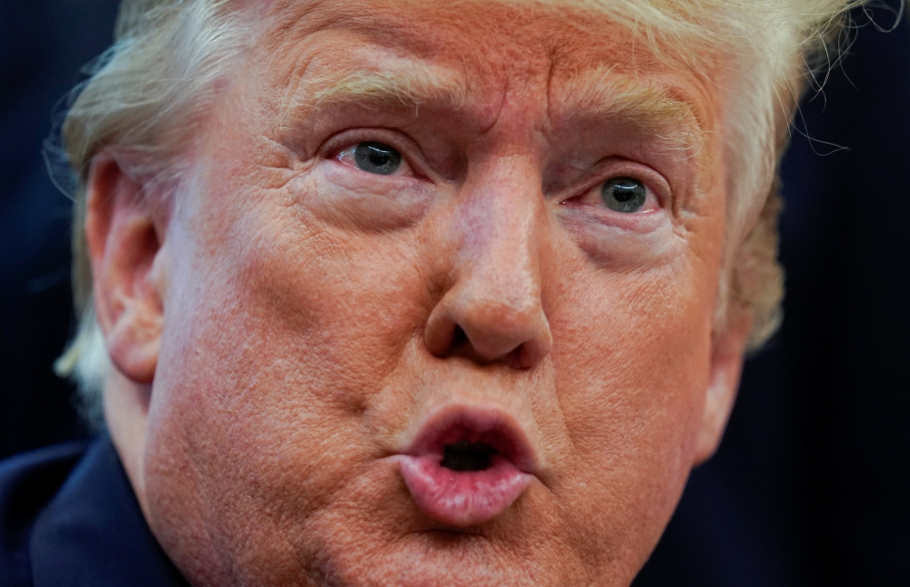 US President Donald Trump speaks to reporters while hosting Team USA for the 2019 Special Olympics World Games in the Oval Office of the White House in Washington on Thursday. — Reuters