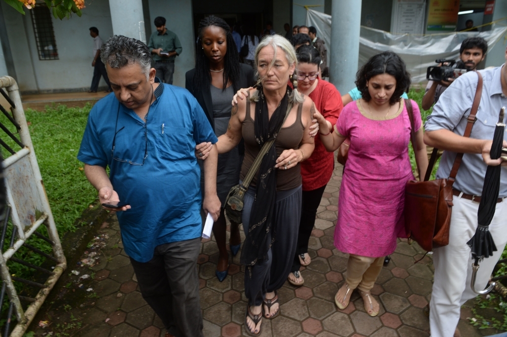 Fiona MacKeown, center, the mother of murdered British schoolgirl Scarlett Keeling, looks on as she leaves the Children's Court in Panaji, Goa, in this Sept. 23, 2016 file photo. — AFP