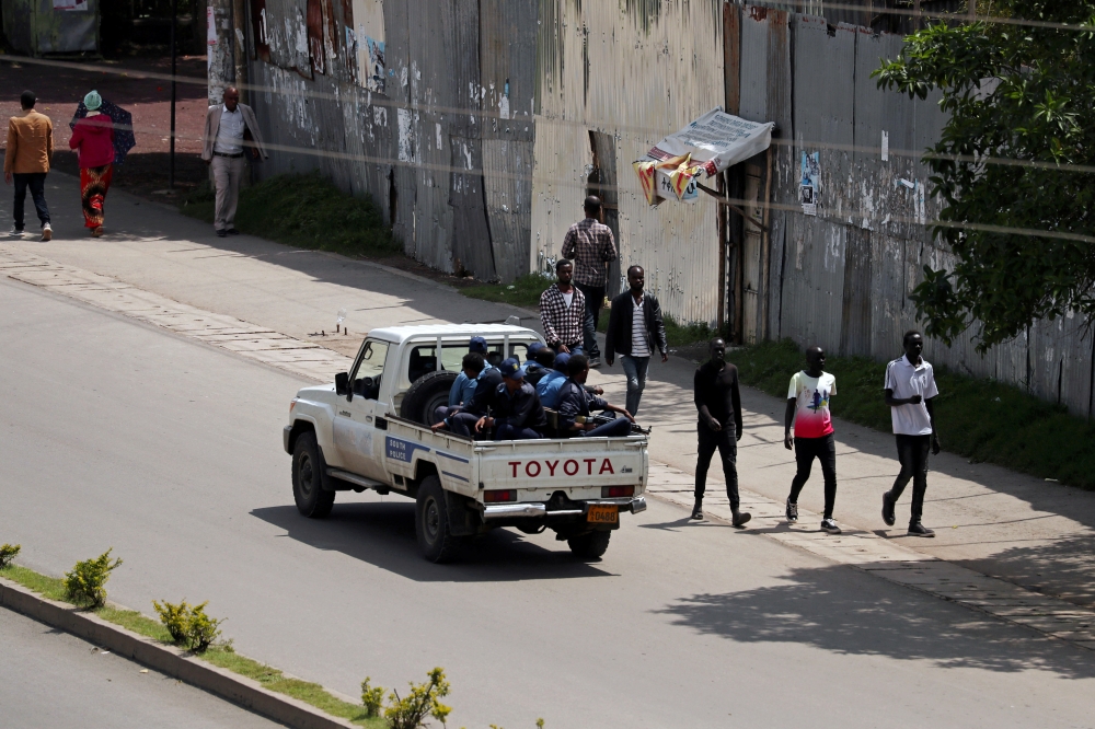 Armed security officers patrol the street during a clash in Hawassa, Ethiopia, on Thursday. — Reuters