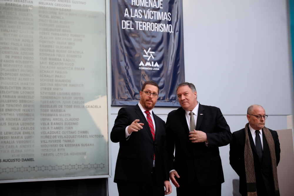 US Secretary of State Mike Pompeo and Argentina's Foreign Minister Jorge Faurie attend a ceremony in memory of the victims of the 1994 bombing attack of the Argentine Israeli Mutual Association (AMIA) community center in Buenos Aires, Argentina, on Friday. — Reuters
