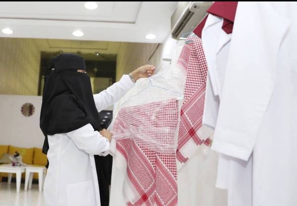 Noura Al-Dousary's shop is entirely manned by Saudi women who were giving a different touch to the laundry of men and women clothes.