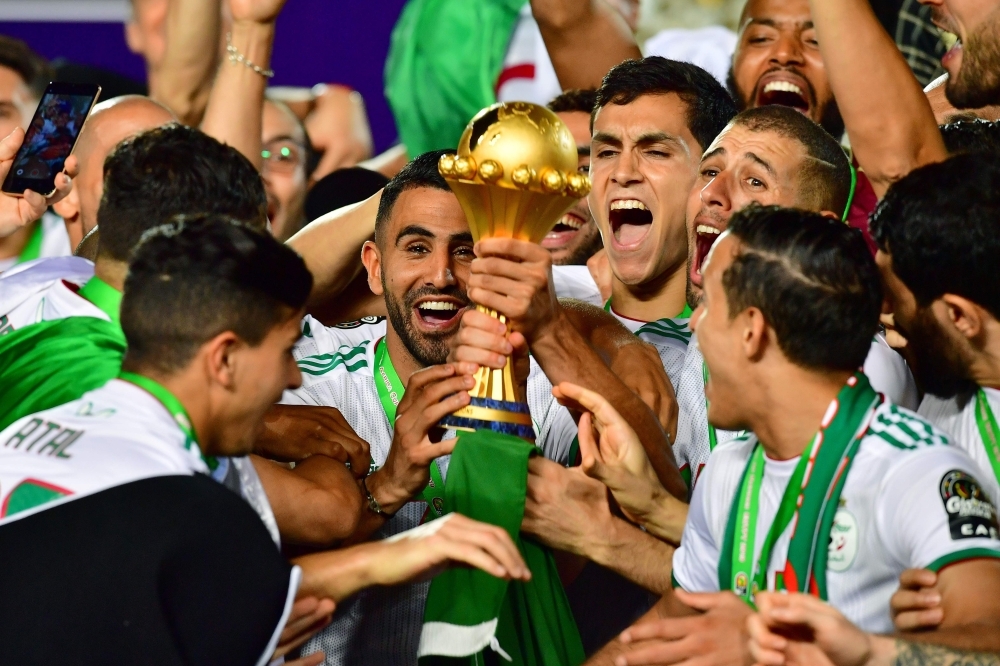 Algerian players celebrate after winning the 2019 Africa Cup of Nations final football match between Senegal and Algeria at the Cairo International Stadium in Cairo on Friday. – AFP