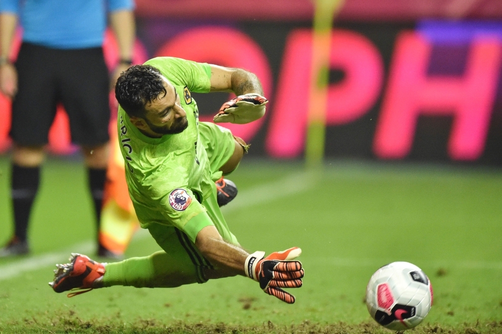 Wolverhampton Wanderers' goalkeeper Rui Patricio saves the ball to win the match against Manchester City during the 2019 Premier League Asia Trophy football tournament at the Hongkou Stadium in Shanghai, on Saturday. — AFP