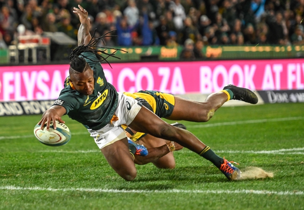 South Africa's Herschel Jantjies scores his try during the 2019 Rugby Championship match South Africa v Australia, at the Emirates Airline Park in Johannesburg, on Saturday. — AFP