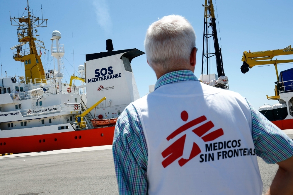 In this file photo taken on June 20, 2018 a member of Doctors Without Borders (MSF) looks at the Aquarius rescue vessel, chartered by French NGO SOS-Mediterranee and Doctors Without Borders (MSF) docked at the port of Valencia before the ship´s departure. -AFP photo