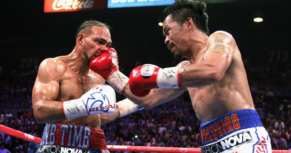 Filipino boxer Manny Pacquiao (C) celebrates after defeating US boxer Keith Thurman during their WBA super world welterweight title fight at the MGM Grand Garden Arena in Las Vegas, Nevada, on Saturday. Pacquiao won a 12 round split decision. – AFP