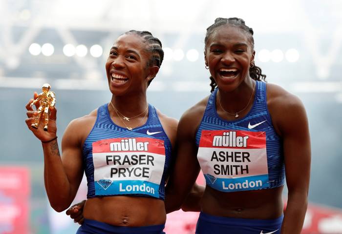 Jamaica's Shelly-Ann Fraser-Pryce poses as she celebrates winning the women's 100m alongside second placed Britain's Dina Asher-Smith during the Diamond League Anniversary Games at London Stadium, London, on Sunday. — Reuters