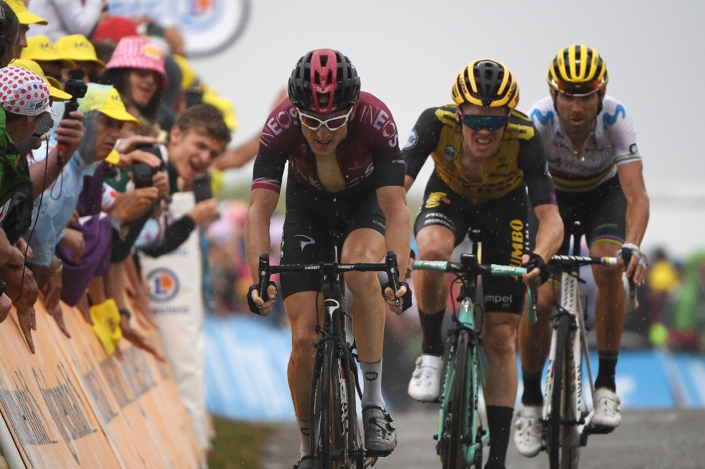 (From Left) Great Britain's Geraint Thomas, Netherlands' Steven Kruijswijk and Spain's Alejandro Valverde make a last effort in the last meters to the finish line of the fifteen stage of the 106th edition of the Tour de France cycling race between Limoux and Foix Prat d'Albis, in Foix Prat d'Albis on Sunday. — AFP