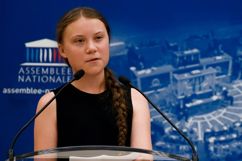 Swedish climate activist Greta Thunberg delivers a speech during a visit of the French National Assembly, in Paris, on Tuesday. -AFP photo