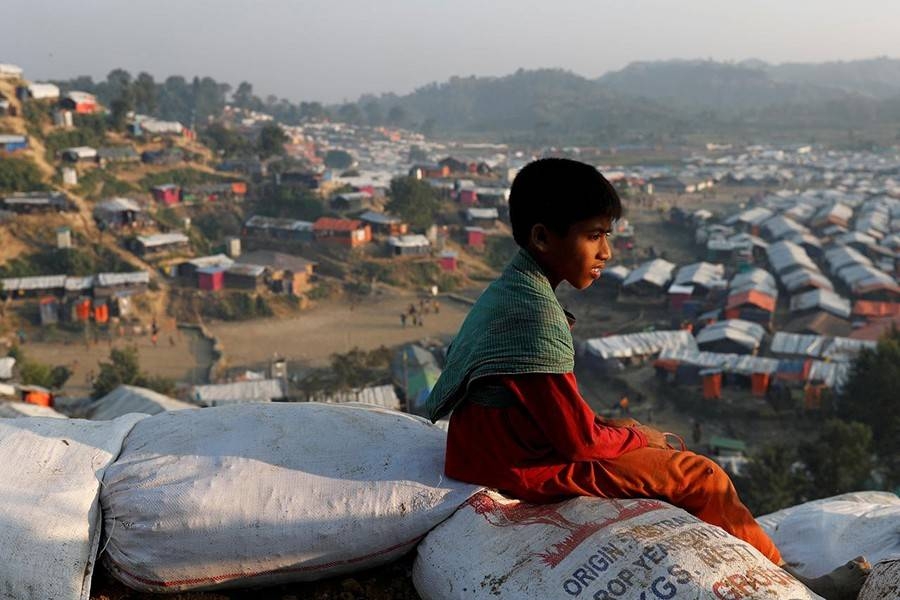 A Rohingya refugee child looks at the view from a hill at Unchiparang refugee camp, near Cox's Bazar, Bangladesh on January 11, 2018  -Reuters photo