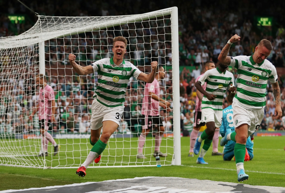 Celtic's Kristoffer Ajer celebrates scoring their first goal with Leigh Griffiths  against Nomme Kalju during the Champions League second round first leg match at Celtic Park, Glasgow, Britain, on Tuesday. —  Reuters