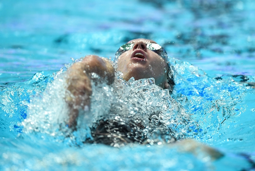 Gold medalist  USA's Simone Manuel (C), silver medalist (L) Australia's Cate Campbell (L0 and bronze medalist Sweden's Sarah Sjoestroem (R) pose after the final of the women's 100m freestyle event during the swimming competition at the 2019 World Championships at Nambu University Municipal Aquatics Center in Gwangju, South Korea, on Friday. — AFP