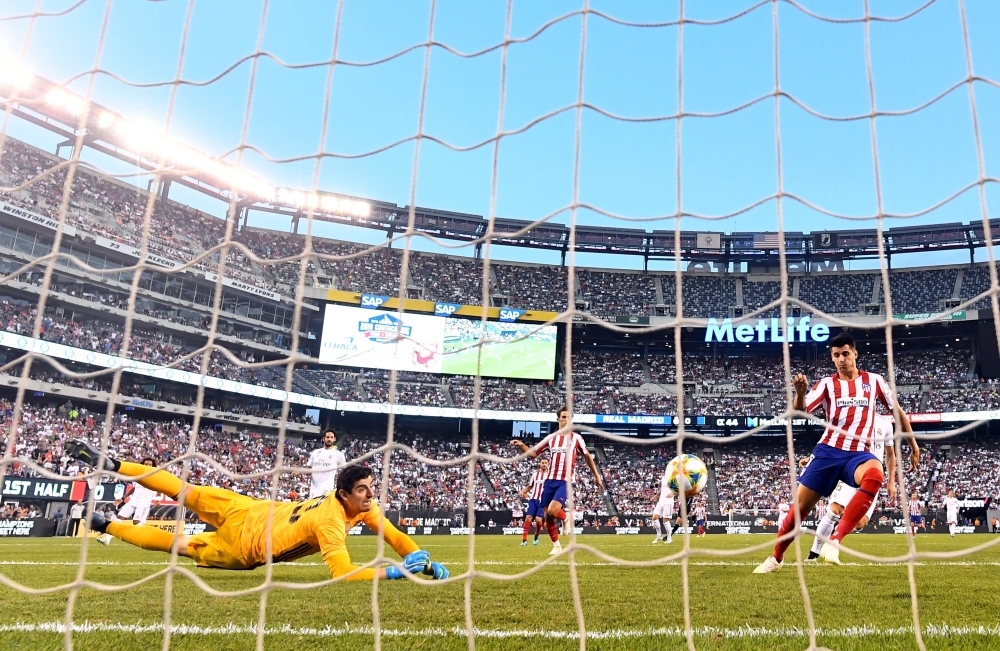 Atletico Madrid's Diego Costa scores his first goal during the 2019 International Champions Cup football match between Real Madrid and Atletico Madrid at the Metlife Stadium Arena in East Rutherford, New Jersey, on on Friday. – AFP