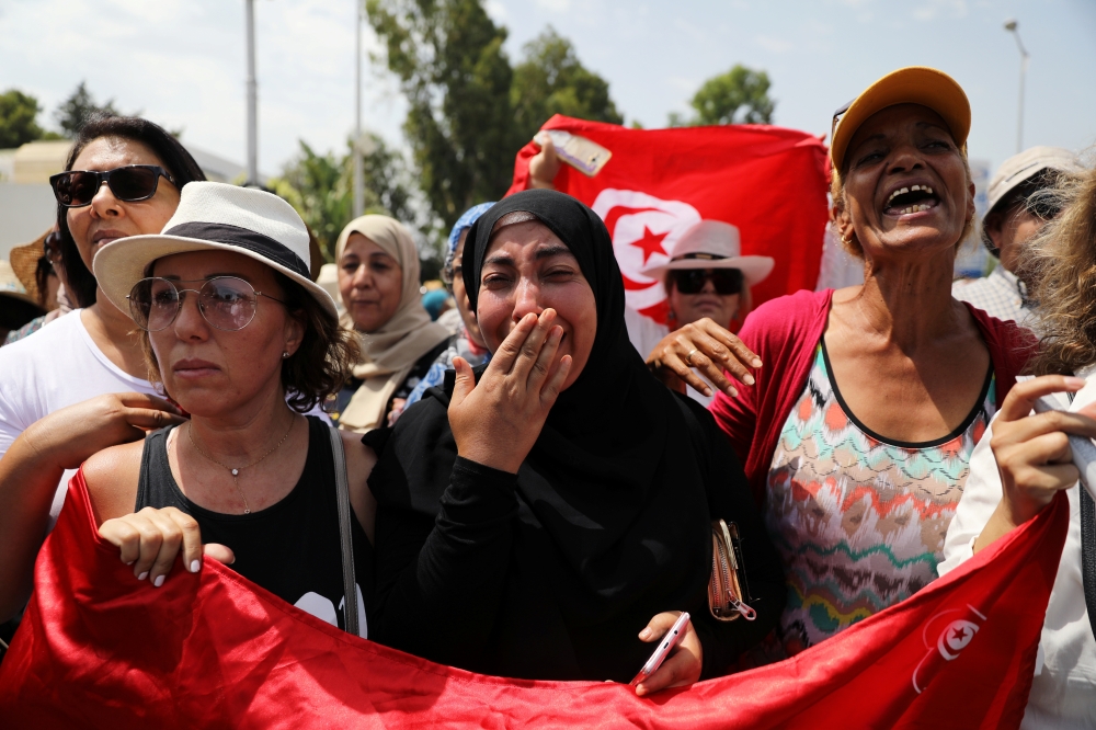 Women react during the funeral of the Tunisian President Beji Caid Essebsi in Tunis on Saturday. -Reuters photo