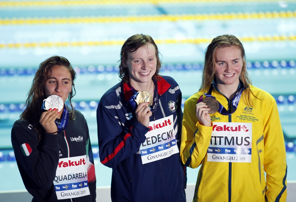 Gold medallists USA's Caeleb Dressel (L), USA's Zach Apple (2L), USA's Mallo Comerford (2R) and USA's Simone Manuel poses with their medals after the final of the mixed 4x100m  freestyle relay event during the swimming competition at the 2019World Championships at Nambu University Municipal Aquatics Center in Gwangju, South Korea, on Saturday. — AFP