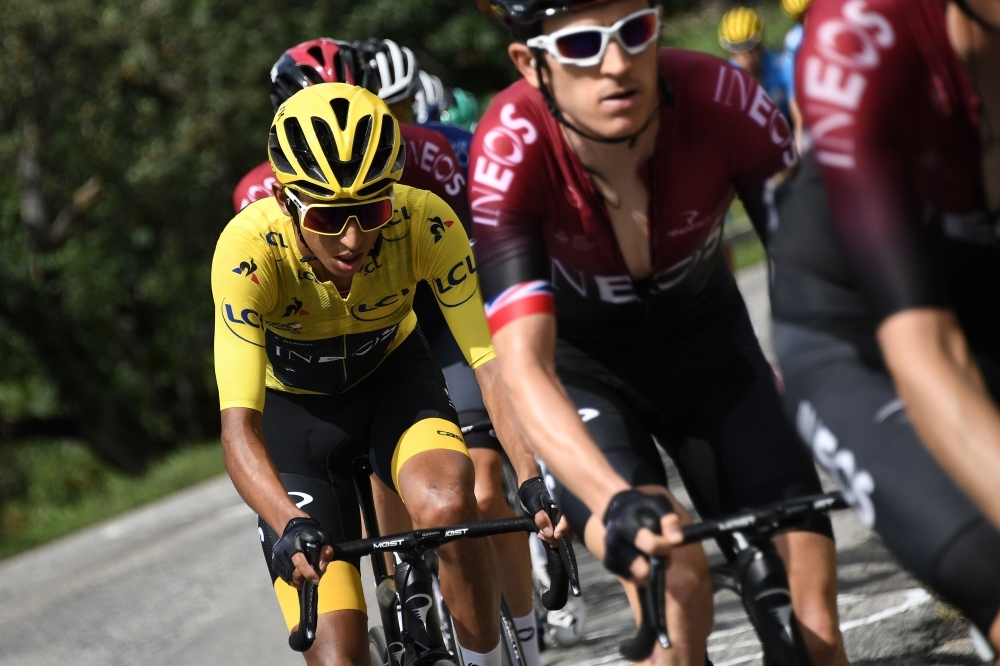 Great Britain's Geraint Thomas (R) and Colombia's Egan Bernal (L), wearing the overall leader's yellow jersey ride in the pack during the twentieth stage of the 106th edition of the Tour de France cycling race between Albertville and Val Thorens, in Val Thorens, on Saturday. — AFP