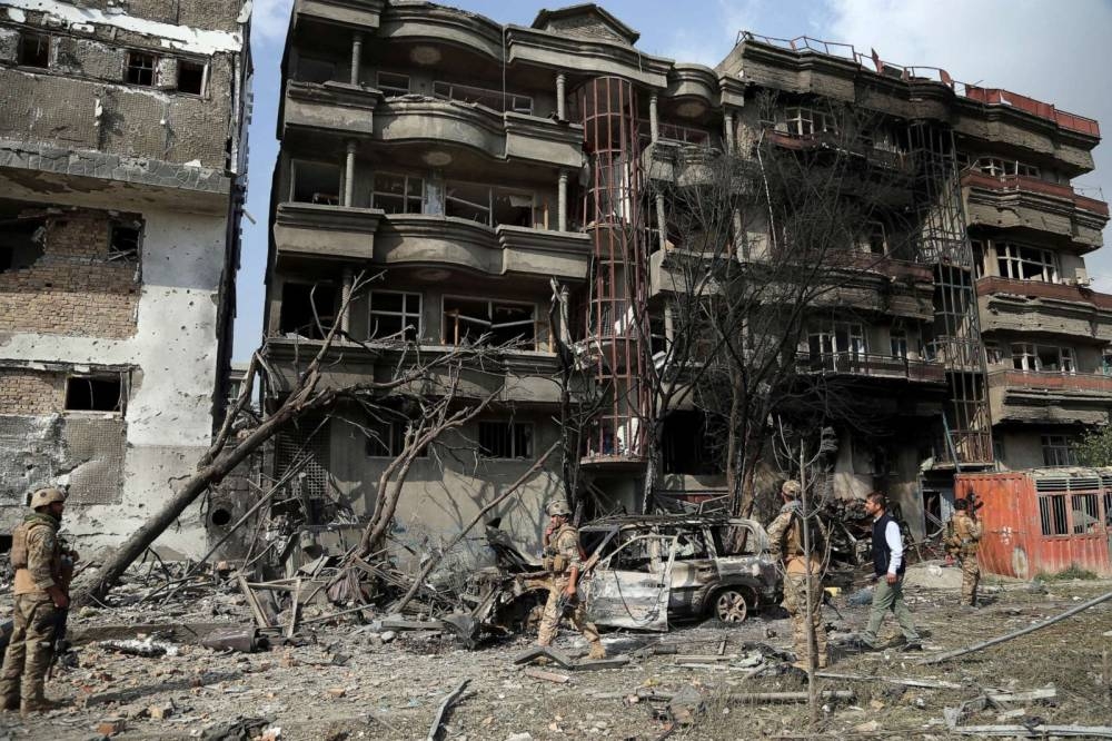 Afghan security forces on Monday inspect the aftermath of Sunday's attack in Kabul. –Courtesy photo