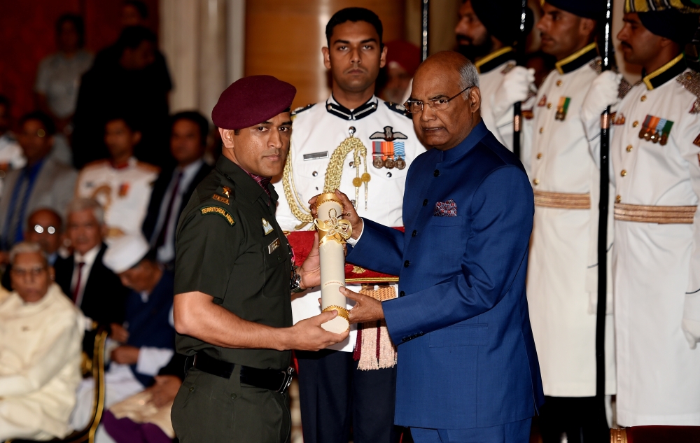 In this file photo taken on April 2, 2018, India's President Ram Nath Kovind confers the Padma Shri award to cricketer Mahindra Singh Dhoni, during an event at the Presidential Palace in New Delhi. — Reuters