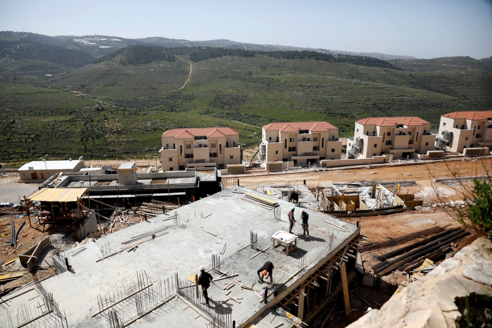 Laborers work at a construction site in the Israeli settlement of Beitar Illit in the Israeli-occupied West Bank in this April 7, 2019 file photo. — Reuters