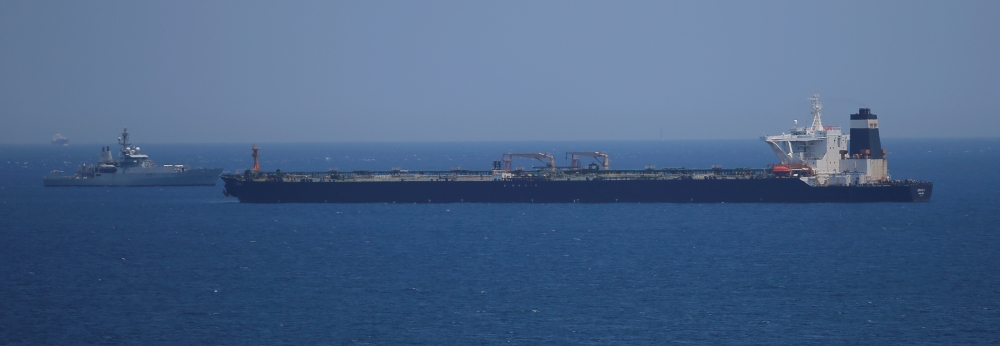 File photo shows a British Royal Navy patrol vessel guards the oil supertanker Grace 1, which is suspected of carrying Iranian crude oil to Syria, as it sits anchored off Gibraltar, July 4, 2019. — Reuters