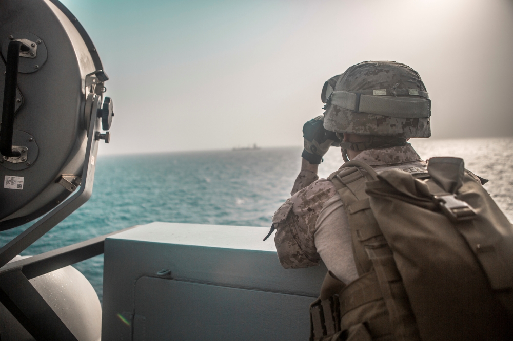 US Marine Corps Cpl. Michael Weeks, ranges nearby boats from USS John P. Murtha during a Strait of Hormuz transit, Arabian Sea off Oman, in this picture released by US Navy on July 18, 2019. — Reuters