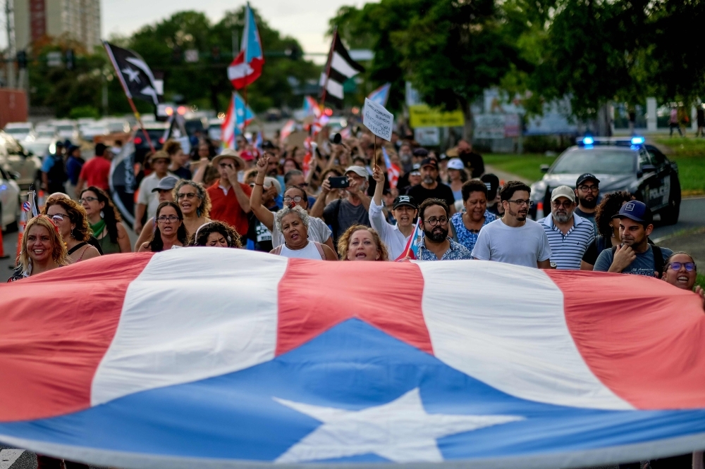 People march in protest against the next in line for Puerto Rico's governor, Wanda Vazquez, Puerto Rico's current Secretary of Justice, in San Juan in this July 29, 2019 file photo. — AFP