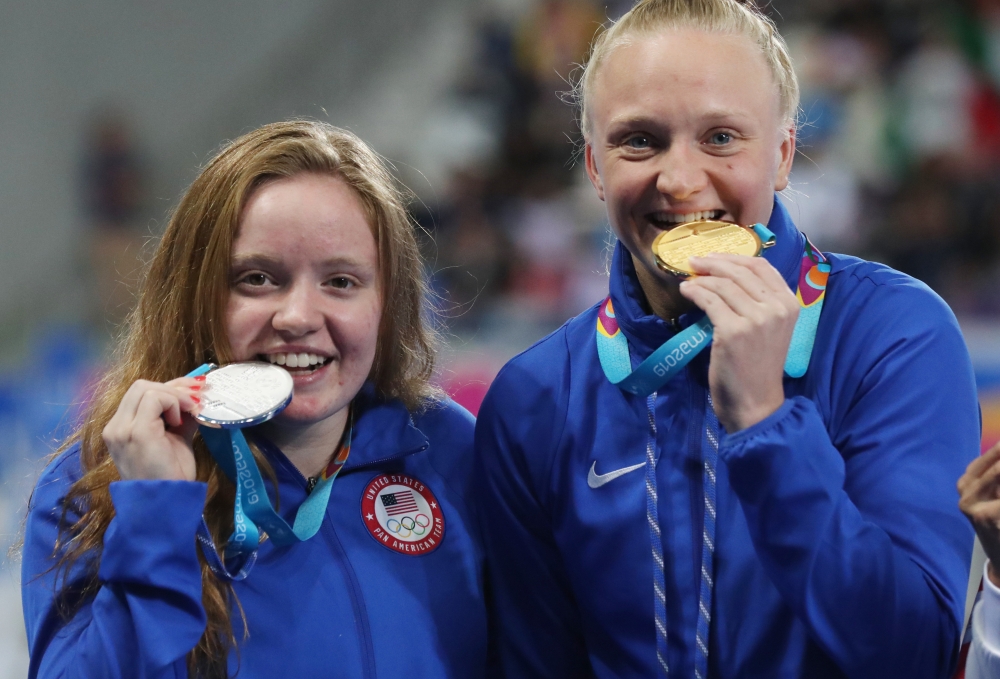 Sarah Bacon (R) and Brooke Schultz of the US smile after winning the gold and silver medals respectively in the women's 1m springboard diving final during Pan American Games at Aquatic Center, Lima, Peru, on Friday. — Reuters