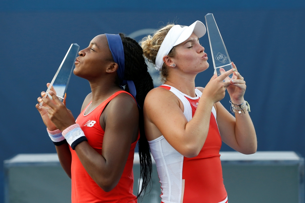 Cori Gauff of the United States (L) and Catherine Mcnally of the United States (R) pose with the champions trophies after their match against Fanny Stollar of Hungary and Maria Sanchez of the United States (both not pictured) in the women's doubles final of the 2019 Citi Open at William H.G. FitzGerald Tennis Center, Washington, DC, USA, on Saturday. — Reuters