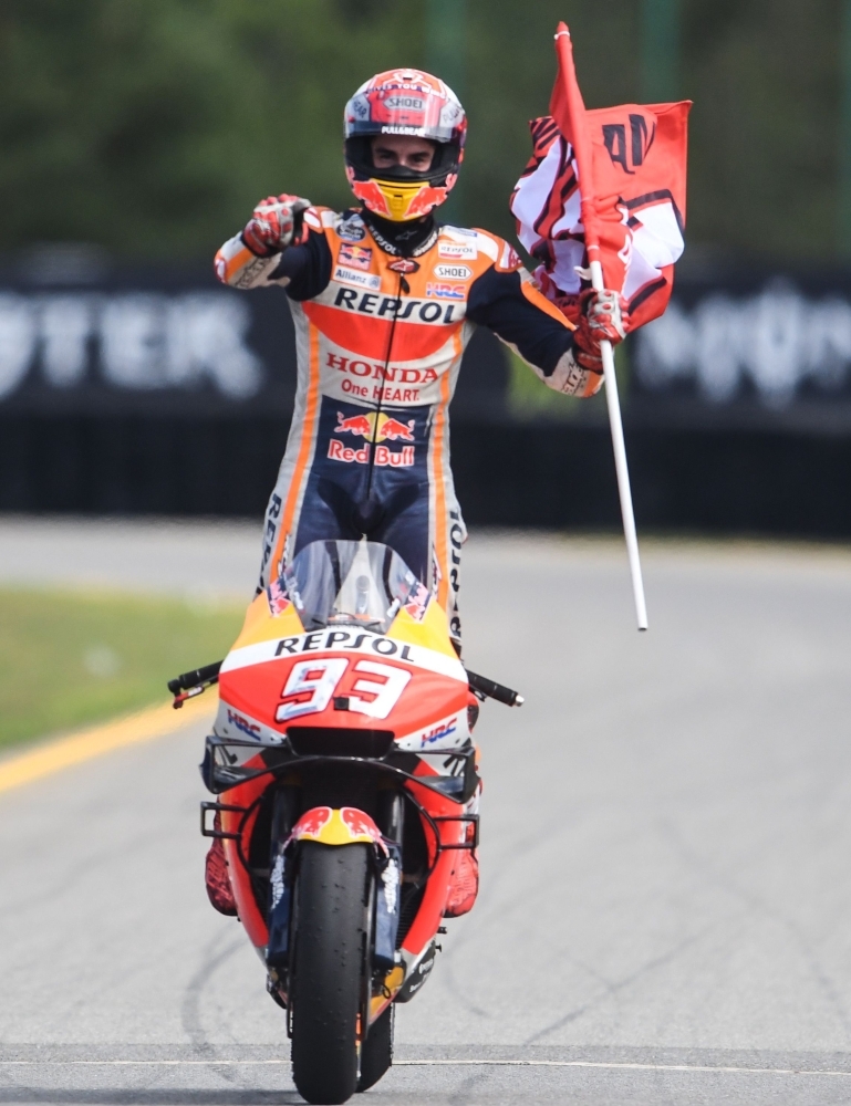 Winner Repsol Honda Team's Spanish rider Marc Marquez celebrates after the Moto GP Czech Grand Prix in Brno, on Sunday. — AFP