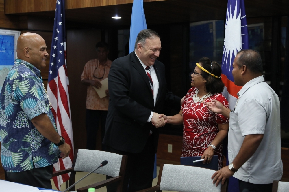 US Secretary of State Mike Pompeo talks after a news conference with Micronesia's President David Panuelo (L), Marshall Islands' President Hilda Heine (2nd R) and Palau's Vice President Raynold Oilouch (R) in Kolonia on Monday. -AFP