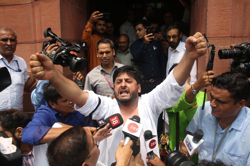Activists and supporters of Indian left wing parties shout slogans in New Delhi on Monday during a demonstration to protest against the presidential decree abolishing Article 370 of the constitution giving special autonomy to Muslim-majority Kashmir. — AFP