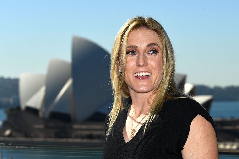 Australian Olympic hurdles champion Sally Pearson poses for pictures in front of the  Opera House after a press conference in Sydney, on Tuesday. — AFP
