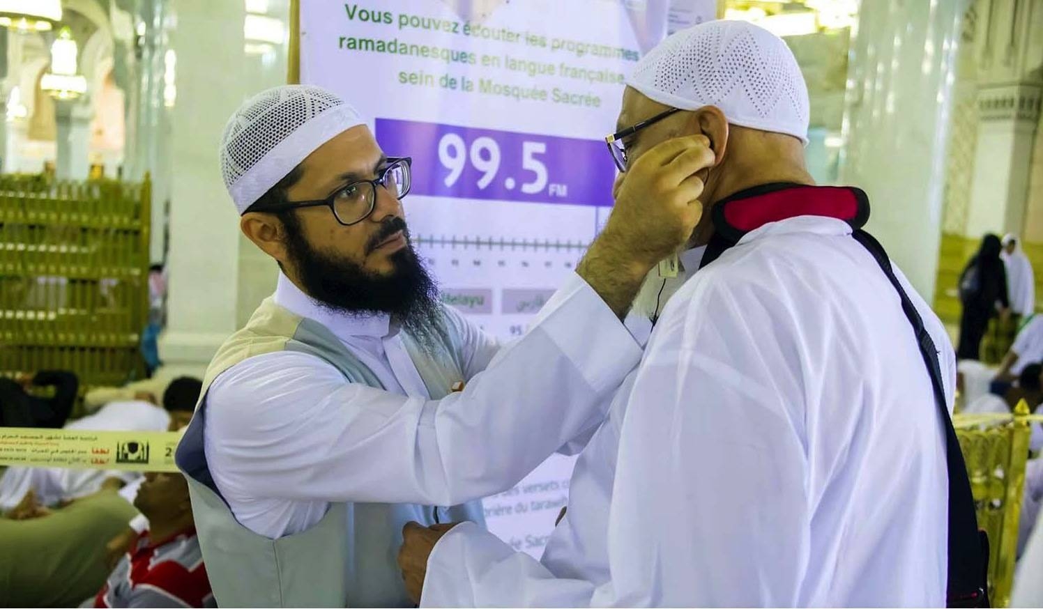 A Haj volunteer assists a pilgrim. — SPA