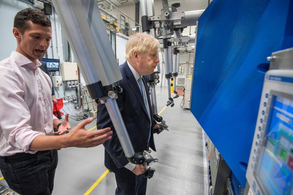 Britain's Prime Minister Boris Johnson visits the Fusion Energy Research Centre at the Fulham Science Centre in Oxfordshire, Britain, on Thursday. — Reuters