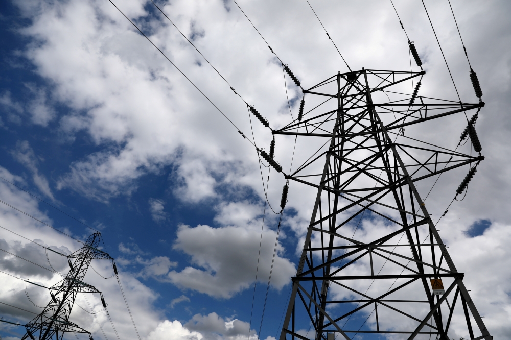 Electricity pylons are seen in London in this Aug. 1, 2017 file photo. — Reuters