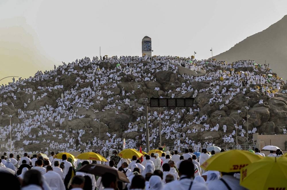 Pilgrims pray at Mount Arafat on Saturday. — SPA