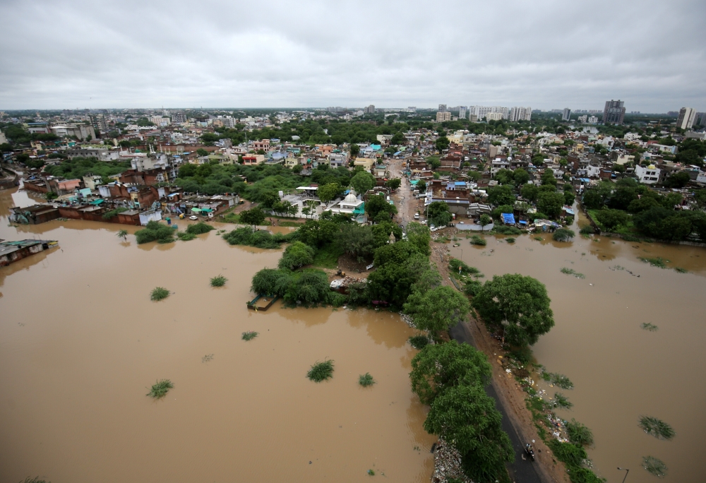 An aerial view shows a flooded residential area after heavy rains in Ahmedabad, India, on Saturday. — Reuters