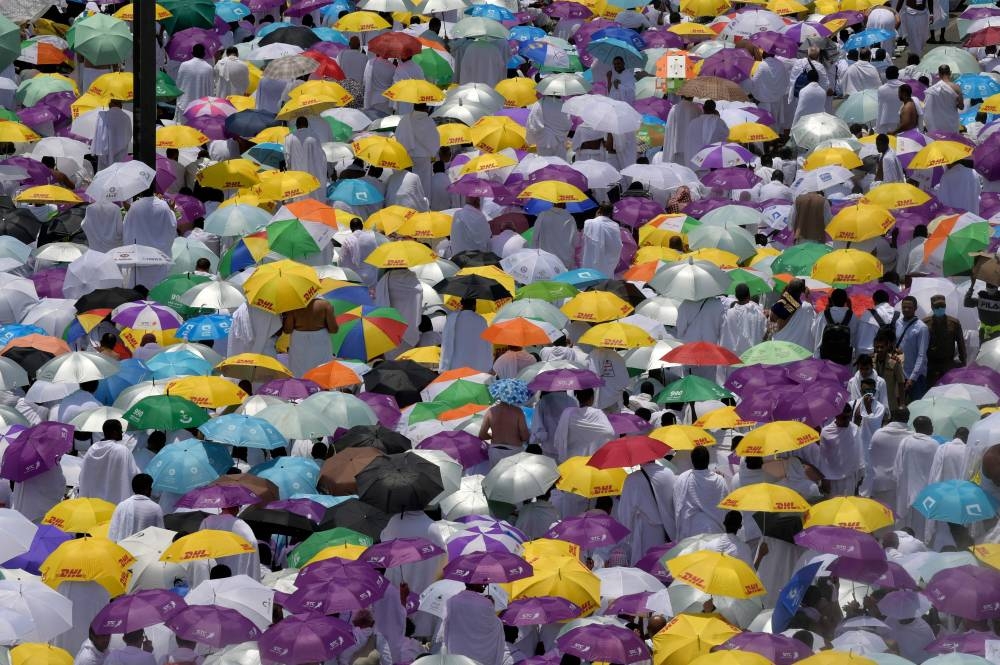 Muslim pilgrims pray outside the Namirah mosquee at Mount Arafat, also known as Jabal al-Rahma (Mount of Mercy), southeast of the Saudi holy city of Makkah, as the climax of the Haj pilgrimage approaches on August 10, 2019.