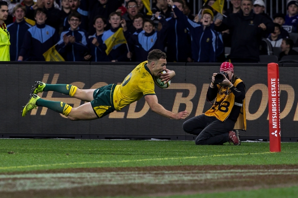 Australia’s Nic White scores a try during the Rugby Championship Bledisloe Cup Test match between the Australian Wallabies and New Zealand All Blacks in Perth on Saturday. — AFP