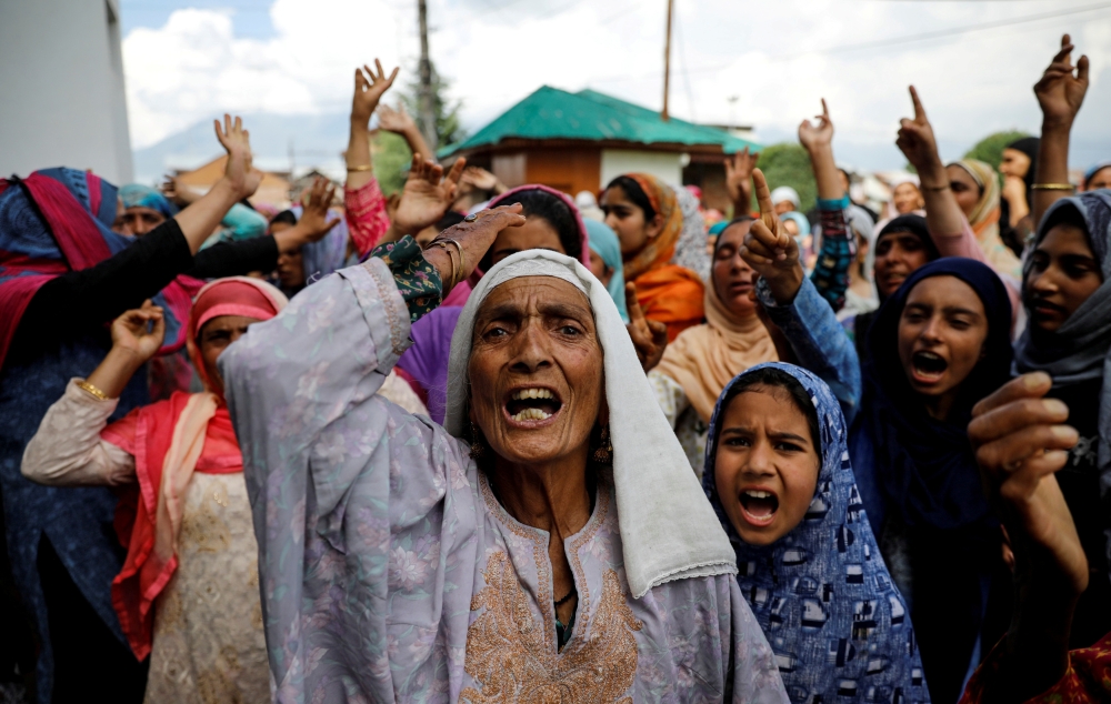 Kashmiri women shout slogans during a protest after the scrapping of the special constitutional status for Kashmir by the Indian government, in Srinagar, on Sunday. -Reuters